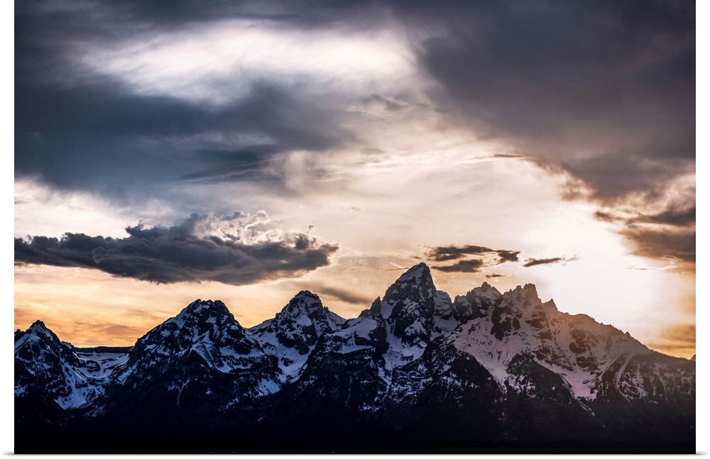 View of dramatic clouds over Teton mountains in Wyoming.