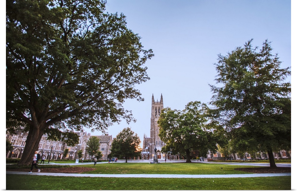 Steeple of Duke Chapel hidden behind trees on Duke University Campus, Durham, North Carolina.