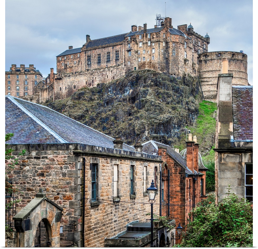 Square photograph of the Edinburgh Castle with old stone buildings in the foreground, Edinburgh, Scotland, UK