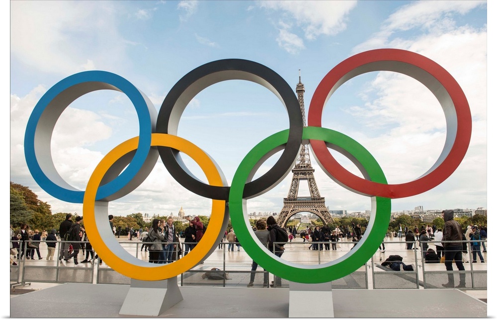 Photograph of the Olympic Rings with the Eiffel Tower in the background.