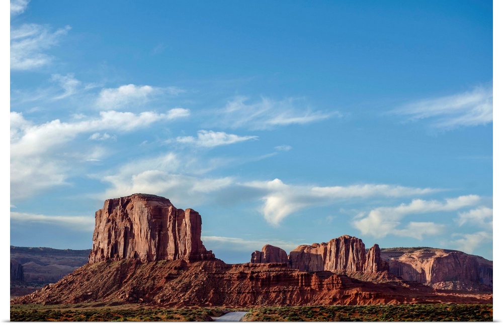 Blue skies hover over Elephant Butte in Monument Valley, Arizona.
