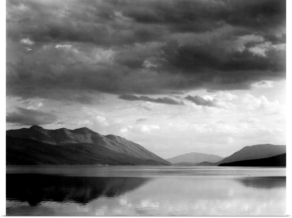 Evening, McDonald Lake, Glacier National Park, looking across lake to mountains and clouds.