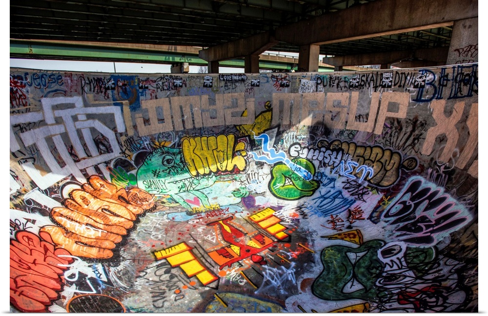 A concrete bowl is covered in graffiti at FDR Skatepark, Philadelphia.