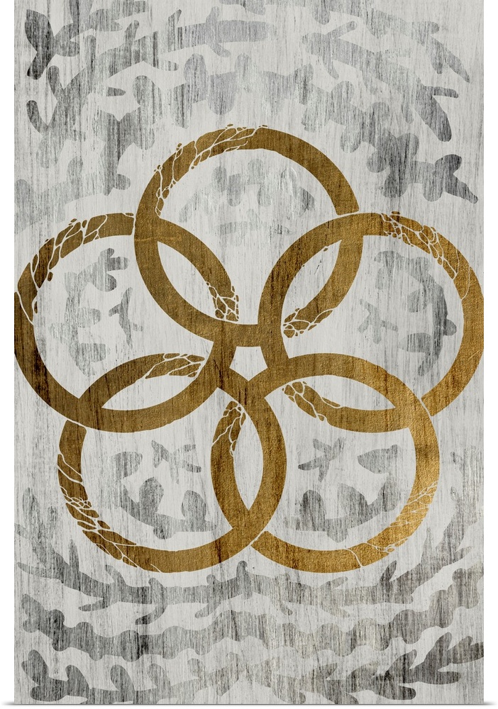 Gold leaf on weathered wood with a fern pattern of five gold rings.