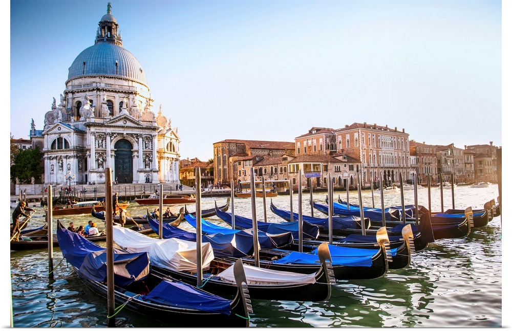 Photograph of gondolas lined up in a row in front of Santa Maria della Salute, Venice, Italy, Europe