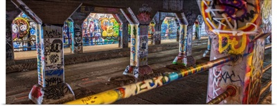 Graffiti covering the columns and railings in the Krog Street Tunnel in Atlanta, Georgia