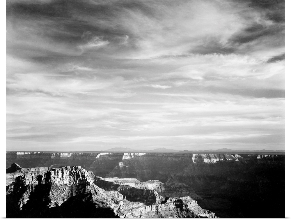 Grand Canyon from N. Rim, 1941, canyon in foreground, horizon, mountains and clouded sky.