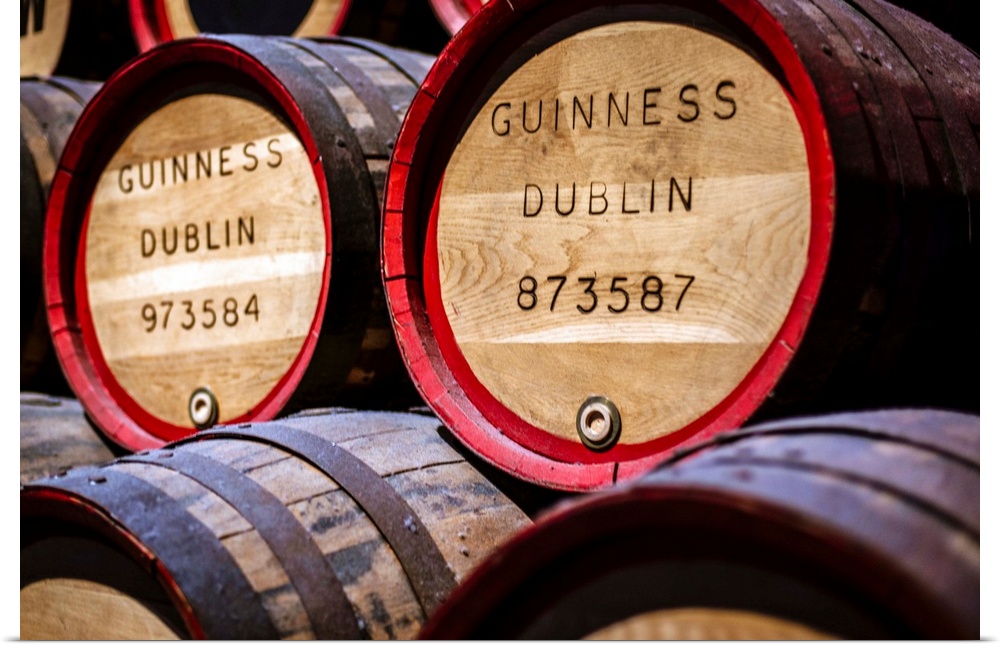 Close-up photograph of Guinness beer barrels on display at the Guinness Storehouse in Dublin, Ireland.