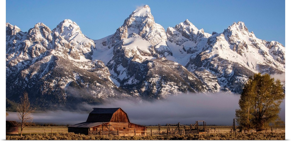 View of the John Moulton Barn with Middle Teton, Grand Teton and Mount Owen in the background. Grand Teton National Park, ...