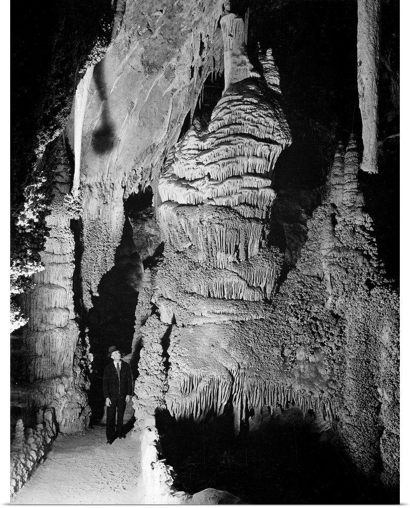 "Large Formation at the "Hall of Giantsin Carlsbad Cavern, path and rock formations, man on path.