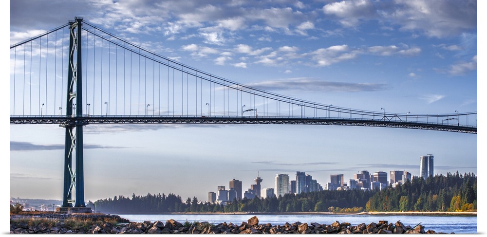 Photograph of Lion's Gate Bridge over the Burrard Inlet with the Vancouver, BC, Canada skyline in the distance.