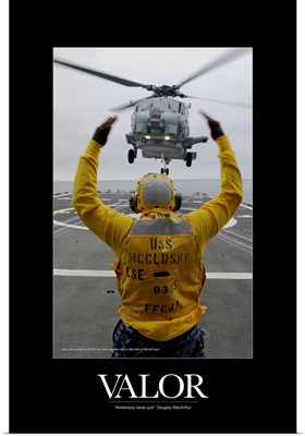 Military Motivational Poster: Petty Officer guides an SH-60R Sea Hawk helicopter