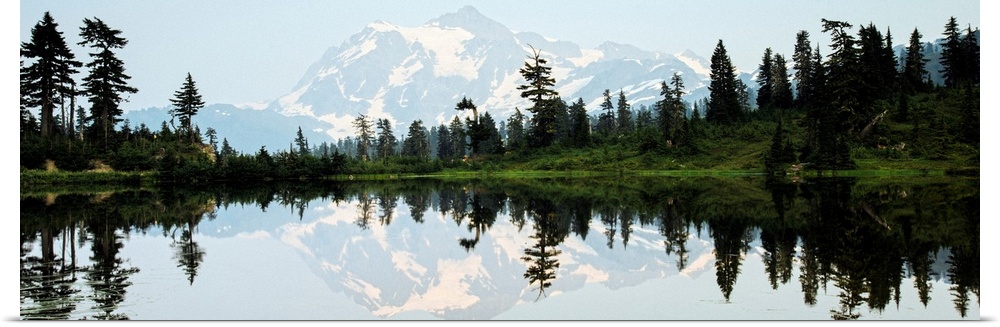 Panoramic photograph of Mt. Shuksan reflecting into Picture Lake around sunset.