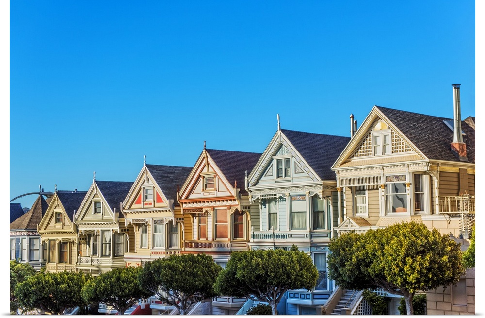 Photograph of the Painted Ladies in downtown San Francisco with a bright blue sky above.