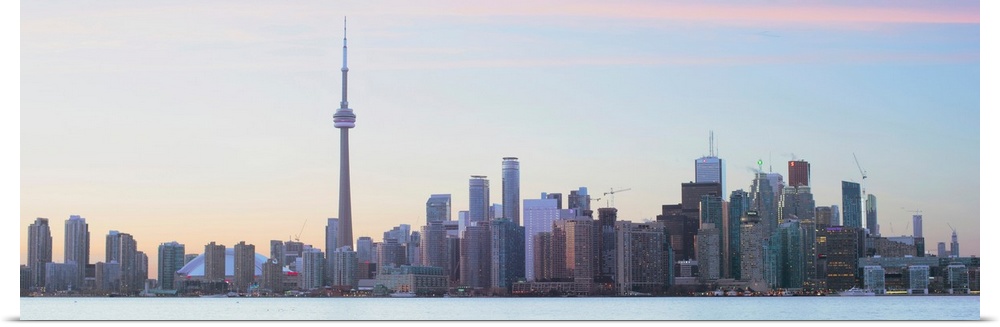 Panoramic photo of Toronto city skyline under a blue sky, Ontario, Canada.