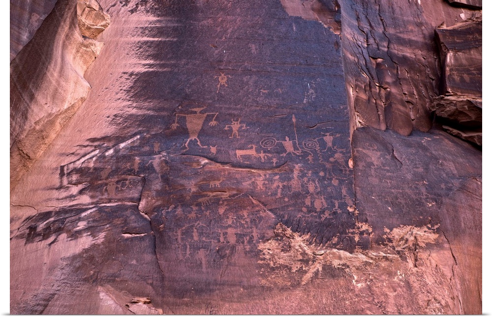 Ancient petroglyphs carved into sandstone on Potash Road, Arches National Park, Moab, Utah.