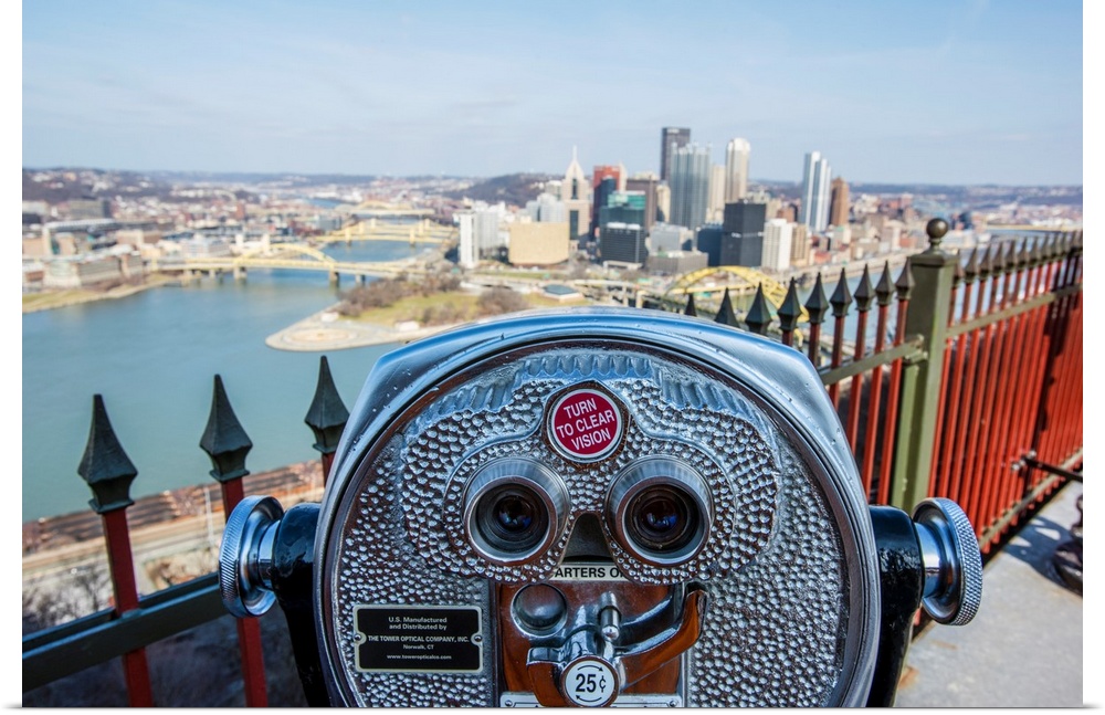 View of downtown Pittsburgh with coin-operated binoculars or tower viewer in the foreground.