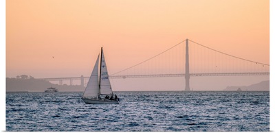 Sailboat Floats In Pacific With Golden Gate Bridge, San Francisco