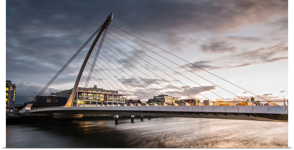 Panoramic photograph of the Samuel Beckett Bridge, a cable-stayed bridge in Dublin, Ireland going across the River Liffey,...
