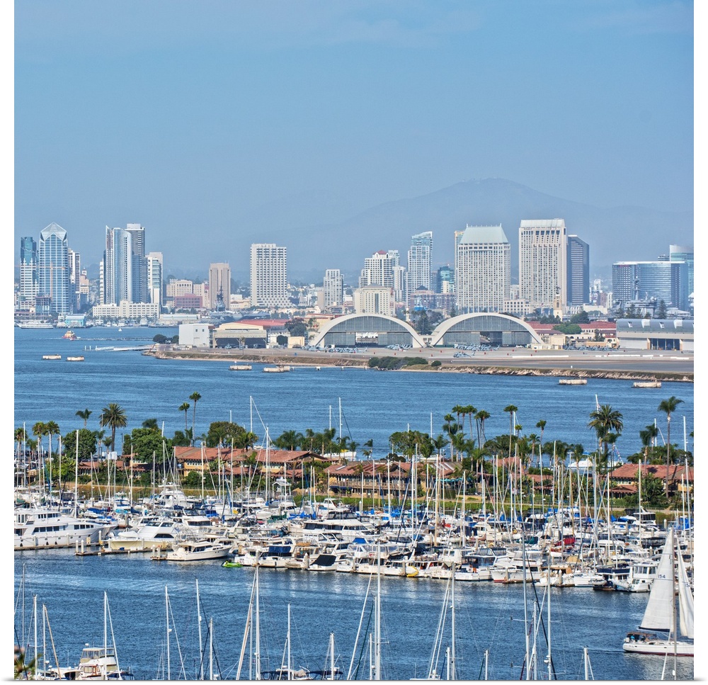Square photograph of the San Diego, California skyline with a marina in the foreground packed with sailboats.
