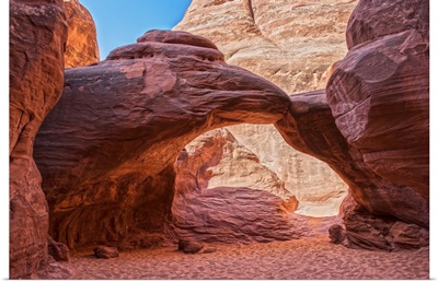 Sand Dune Arch over a sandy red trail, Arches National Park, Utah
