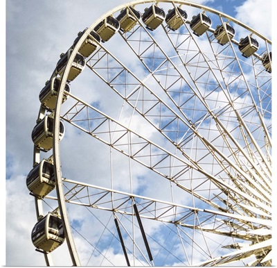 SkyView Atlanta, a giant Ferris Wheel in Centennial Park, against a cloudy sky.