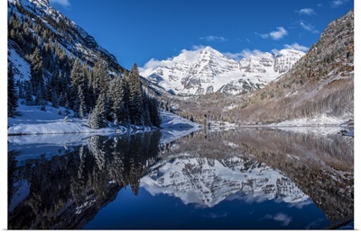 Snowy Maroon Bells mirrored in Maroon Lake below, Aspen, Colorado
