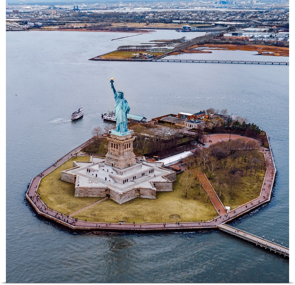Aerial view of the Statue of Liberty on Liberty Island on a grey day.