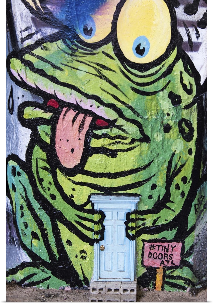 Graffiti of a frog with a miniature door, part of the Tiny Doors art project, in Krog Street Tunnel, Atlanta, Georgia.