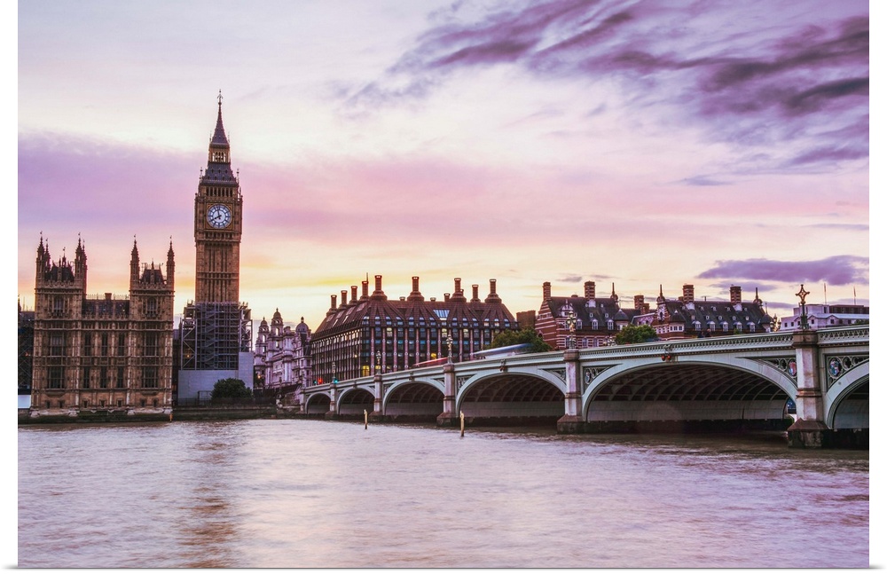 Photograph of Big Ben and the Westminster Bridge with a pink and purple sunset.