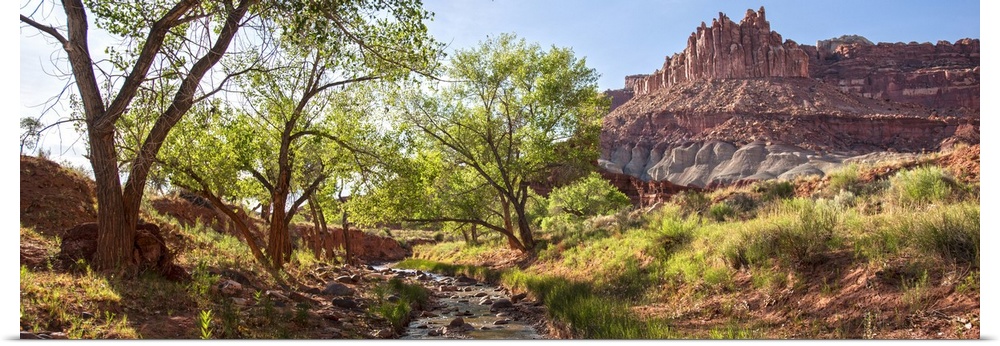 View of 'The Castle' rock formation near a stream at Capitol Reef National Park.