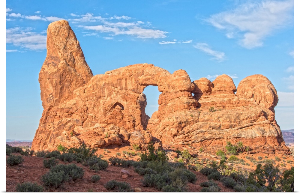 The Turret Arch under a blue sky in Arches National Park, Utah.