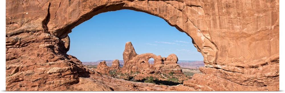 The Turret Arch seen through the North Window Arch, on Windows hiking trail, Arches national Park, Moab, Utah.