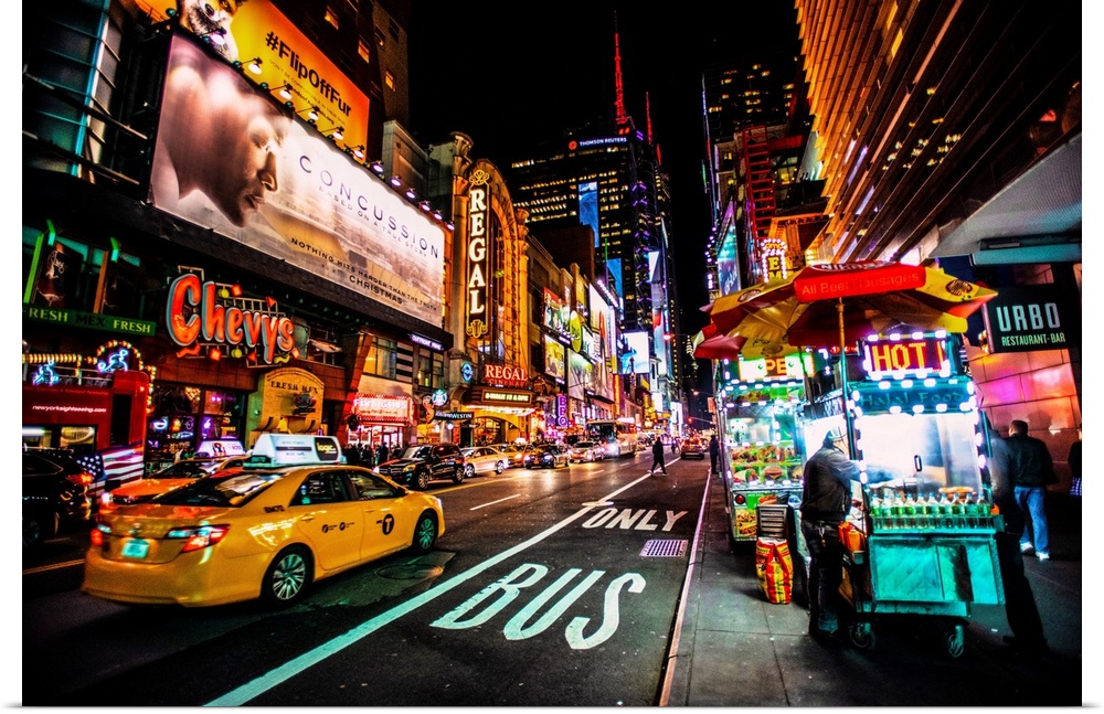 View of advertising signs on 42nd street in New York city at night.