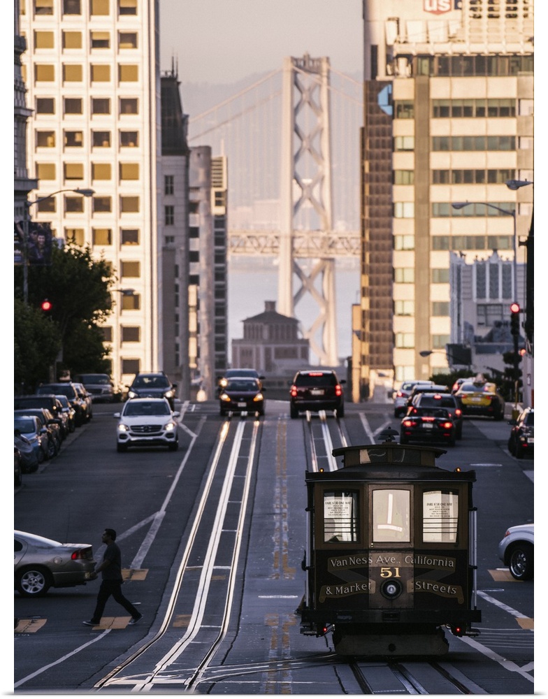 Photograph of the Van Ness Ave. and Market Streets Trolley with the Bay Bridge in the background.