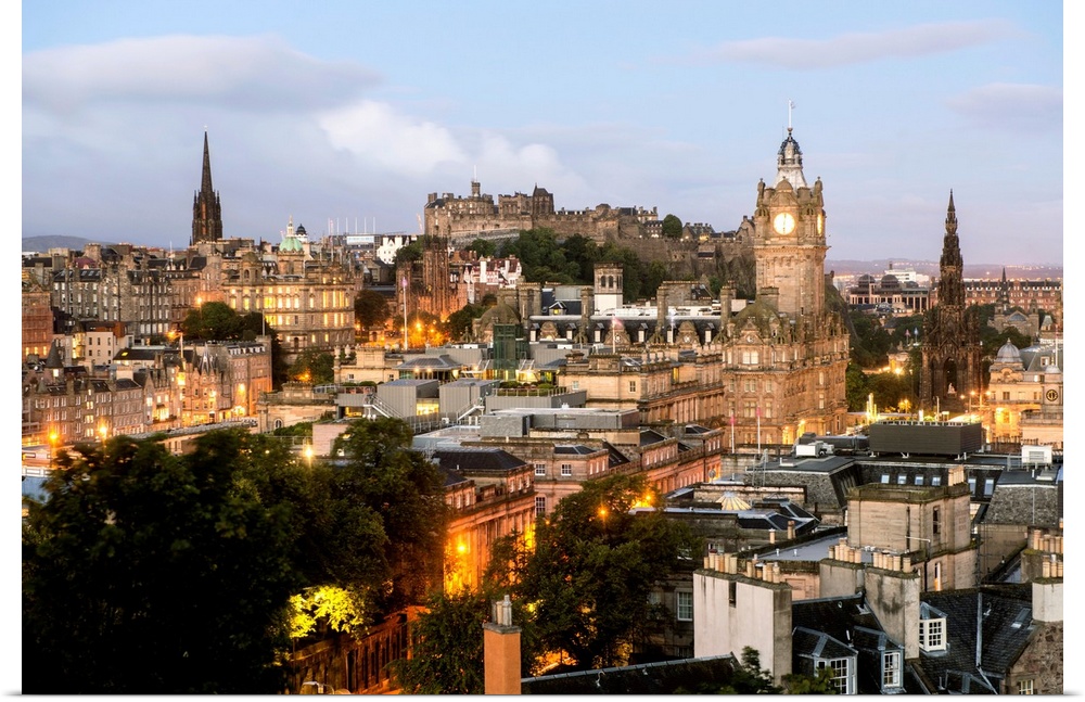 Photograph of the view of Edinburgh city centre from Calton Hill in Edinburgh, Scotland, UK at sunset.