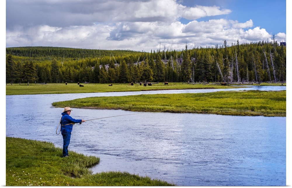 Person fishing along a river at Yellowstone National Park.