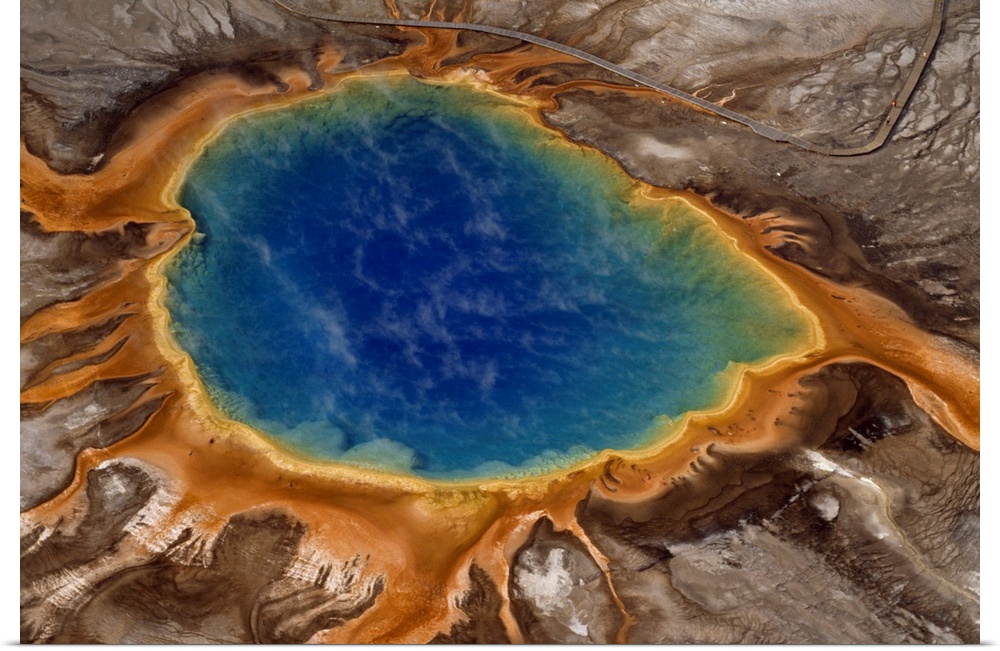 Algae-tinted shallows ring Yellowstone's steaming Grand Prismatic Spring.  At 370 feet in width, it is the largest hot spr...