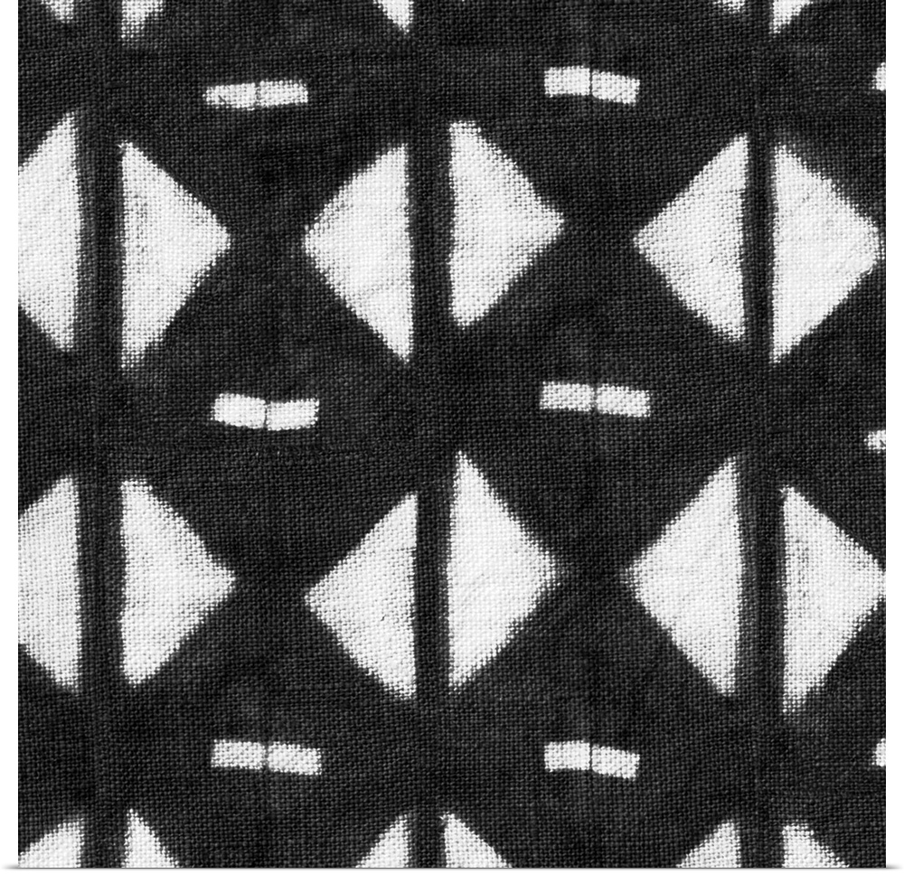 Decorative design of rows of white diamonds with lines going through them on black linen.