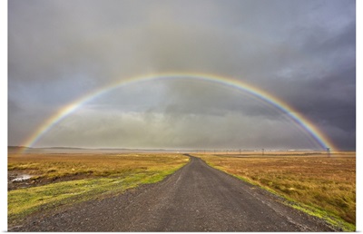 A Rainbow Straddles A Road In Countryside Near Rif, Snaefellsnes Peninsula, Iceland