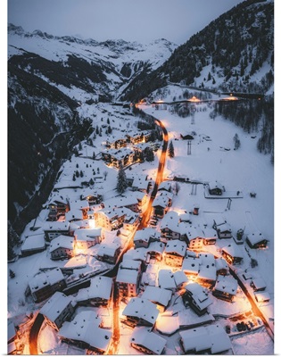 Aerial View Of Illuminated Mountain Huts Covered With Snow, Lombardy, Italy