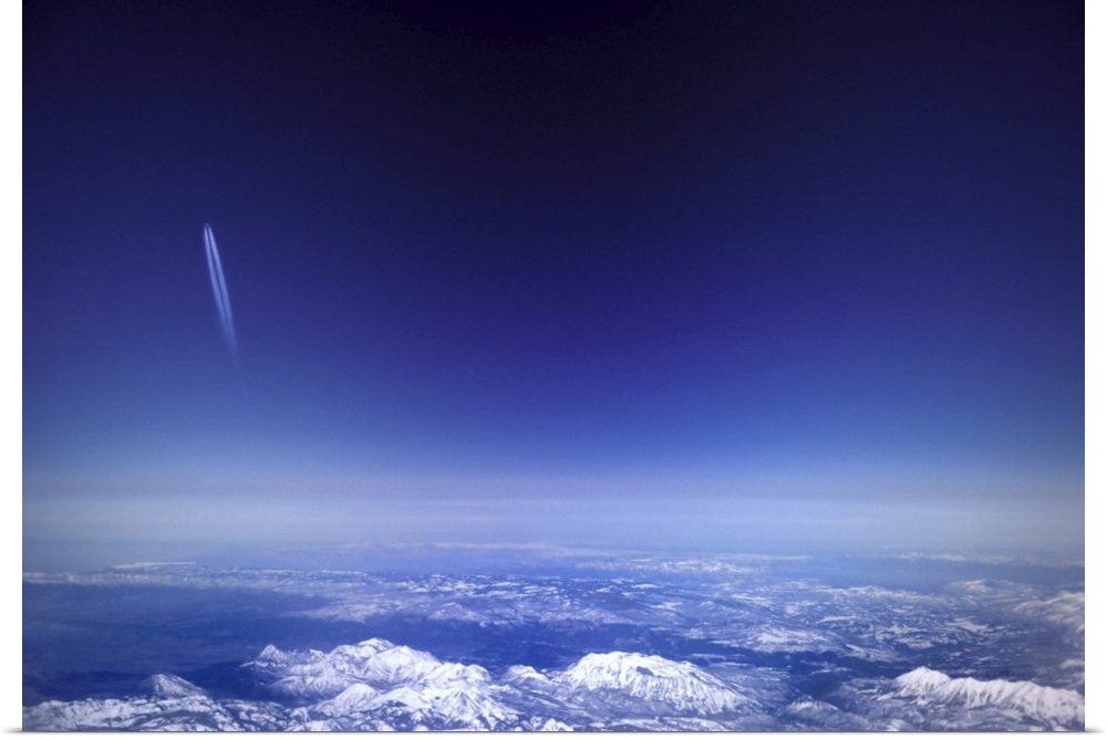Aircraft vapour trails above clouds over Colorado