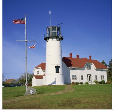 American flag flying beside the Chatham lighthouse, Cape Cod, Massachusetts