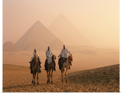 Camel riders at Giza Pyramids, Giza, Cairo, Egypt, Africa