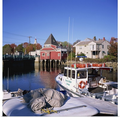 Cruise boat in harbour with wooden buildings, Maine, New England, USA