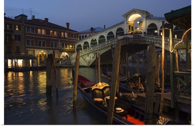Grand Canal, Rialto Bridge at night, gondolas on waterfront, Venice, Veneto, Italy