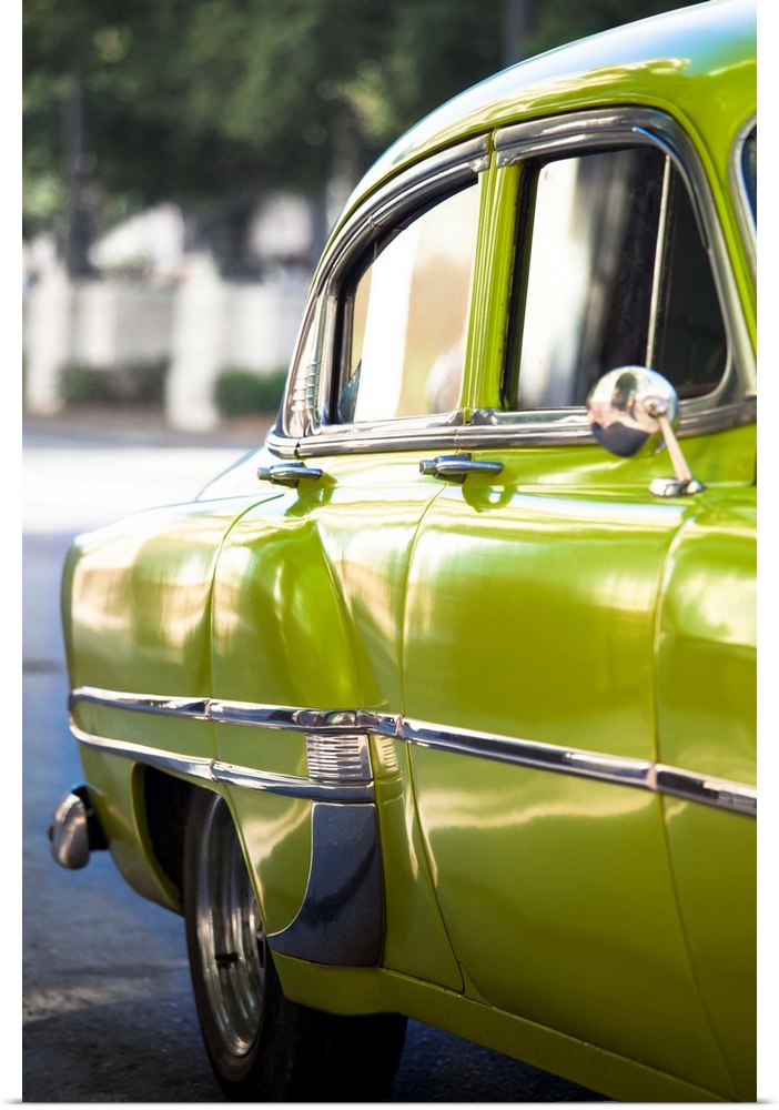 Green vintage American car parked on a street in Havana Centro, Havana, Cuba