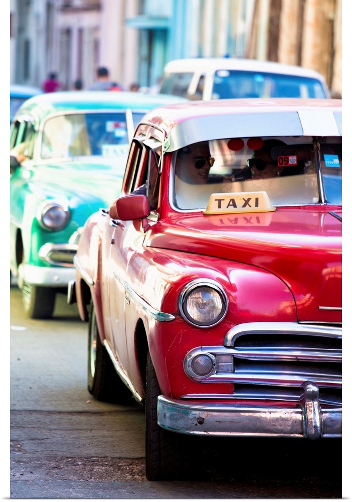 Vintage American cars used as local taxis, driving down Avenue Colon during afternoon rush hour, Havana Centro, Havana, Cu...
