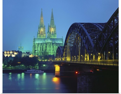 Hohenzollernbrucke and the Cathedral Illuminated at Night, Cologne, Germany