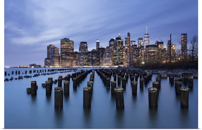 Lower Manhattan Skyline With Wooden Posts From An Old Pier, New York City